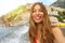 Portrait of attractive young woman in Positano village on Amalfi Coast, Italy. Blonde smiling bikini girl with Positano village o