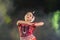 Portrait of authentic Odissi Dancer performing Odissi Dance on stage at Konark Temple, Odisha, India.