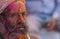 Portrait of a Baba with colours on his face inside a Temple,nandgaon,Uttarpradesh,India