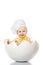 Portrait baby boy dressed in s chef`s hat sitting in egg shell. isolated on white background. Children`s Emotions