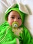 Portrait of a baby boy in a rabbit costume with a babys dummy in his mouth
