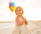 Portrait of baby girl holding colorful windmill