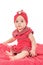 Portrait of a baby girl nice dressed in red clothes looking for attention