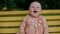 Portrait of baby girl on the swing.