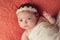 Portrait of a Baby Girl Wearing a Lace and Pearl Headband