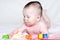 Portrait of baby with multi-colored paints