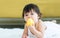 Portrait baby sweet healthy little girl biting toy, playing alone with happiness, crawling on floor in indoor comfortable living