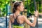 Portrait from the back of a sports woman with a rope on the playground