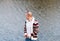 Portrait of the bald man against the background on autumn lake.