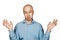 Portrait bald unsure man doesn`t understand anything and spreads his hands. guy in a blue shirt on white isolated background in