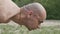 Portrait of bald yogi looks down