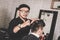 Portrait of barber hairstyle a costumer hair with hand and pomade in barbershop or salon