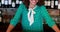 Portrait of barmaid smiling at bar counter