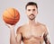 Portrait, basketball and man with fitness, sport and exercise with motivation on grey studio background. Face, male