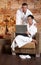 Portrait of bathrobe couple with laptop
