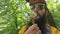 Portrait of a beard man blowing on the ripened dandelion. Slow motion video.