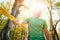 Portrait of a bearded aged man. Smiling positive athlete tightrope walker next to stretched slackline in sunny autumn