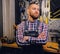 Portrait of bearded bicycle mechanic with crossed arms.