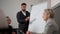 Portrait of bearded businessman manager coach leading business meeting, give flip chart presentation, training