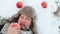 Portrait of a bearded man with an apple in the winter. A young bearded man eats an apple in the winter.