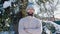 Portrait of a bearded man in a winter knitted hat with a pompom