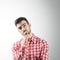 Portrait of bearded thinking young man looking up