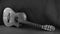 Portrait of a beautiful acoustic guitar lying on the floor in diagonal position