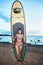 Portrait of beautiful active woman spending summer holidays on the beach, enjoying surfing, Bali, Indonesia