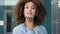 Portrait of beautiful african american girl student ethnic afro mixed race woman female model with curly hair stylish