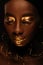 Portrait of beautiful african woman with creative gold makeâ€“up and jewelry