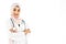 Portrait of beautiful asian muslim woman doctor smiling with folded arms isolated over white background