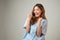 Portrait of a beautiful Asian woman in patient gown raised her arms to cheer up and feel lucky after annual check up with good