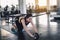 Portrait of Beautiful Asian Women is Exercising With Roller Wheel in Gym, Attractive Sporty Girl is Abdominal Exercised with Rolli