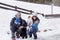 Portrait of a beautiful black labrador and his owner outdoors in the mountain having fun. Pets in nature