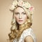 Portrait of a beautiful blonde woman with flowers in her hair