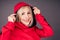 Portrait of a beautiful blonde woman perfect skin and makeup put on hood hoodie sweatshirt red tracksuit sports suit hip