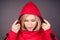 Portrait of a beautiful blonde woman perfect skin and makeup put on hood hoodie sweatshirt red tracksuit sports suit hip