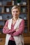 Portrait of beautiful blondie woman looking at camera and smiling. Adult stylish businesswoman at workplace in office