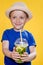 Portrait of a beautiful boy. Happy child. European boy in a hat, summer t-shirt with lemonade. Summer, vacation, vacation, sun,