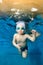 Portrait of a beautiful boy in a Santa hat and glasses in a pool underwater. Baby learns to swim underwater. Active