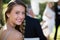 Portrait of beautiful bridesmaid smiling in park