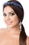 Portrait of beautiful brunette woman with big earring and shinny accessories in hair. Perfect arabic makeup with long