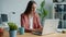 Portrait of beautiful busineswoman working with laptop smiling sitting at desk