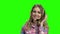 Portrait of beautiful call center operator on green screen.