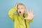 Portrait of beautiful caucasian little boy isolated on blue studio background