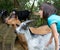 Portrait of beautiful child with farm goats, contact to nature