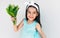 Portrait of the beautiful child holds the bouquet of white flowers for her mother. Cute kid smiling and holds a bouquet on white
