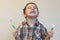 portrait of a beautiful cute caucasian blond boy with a toothbrush. Little boy brushing teeth and smiling while taking care of