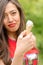 Portrait of beautiful disappointed young woman eating delicious ice cream