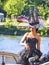 Portrait of the beautiful elegant luxury brunette model wearing a hat which stands on a schooner at Armada exhibition in France